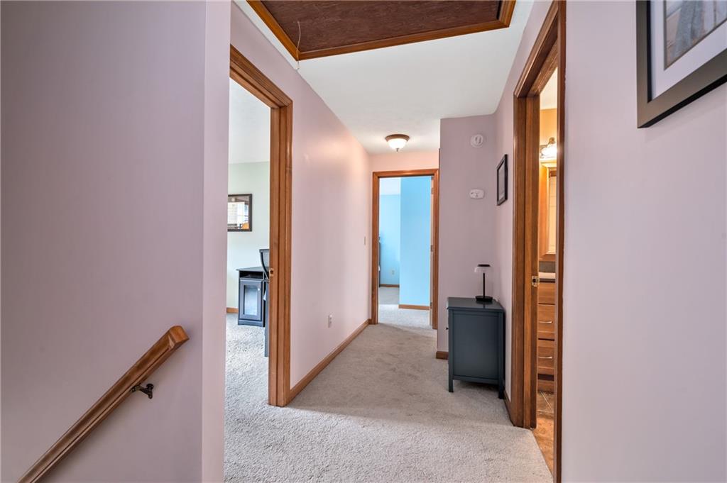 122 Rippling Brook Drive Sewickley, PA 15143 - Photo 23 of 31 a view of a hallway with wooden shelves