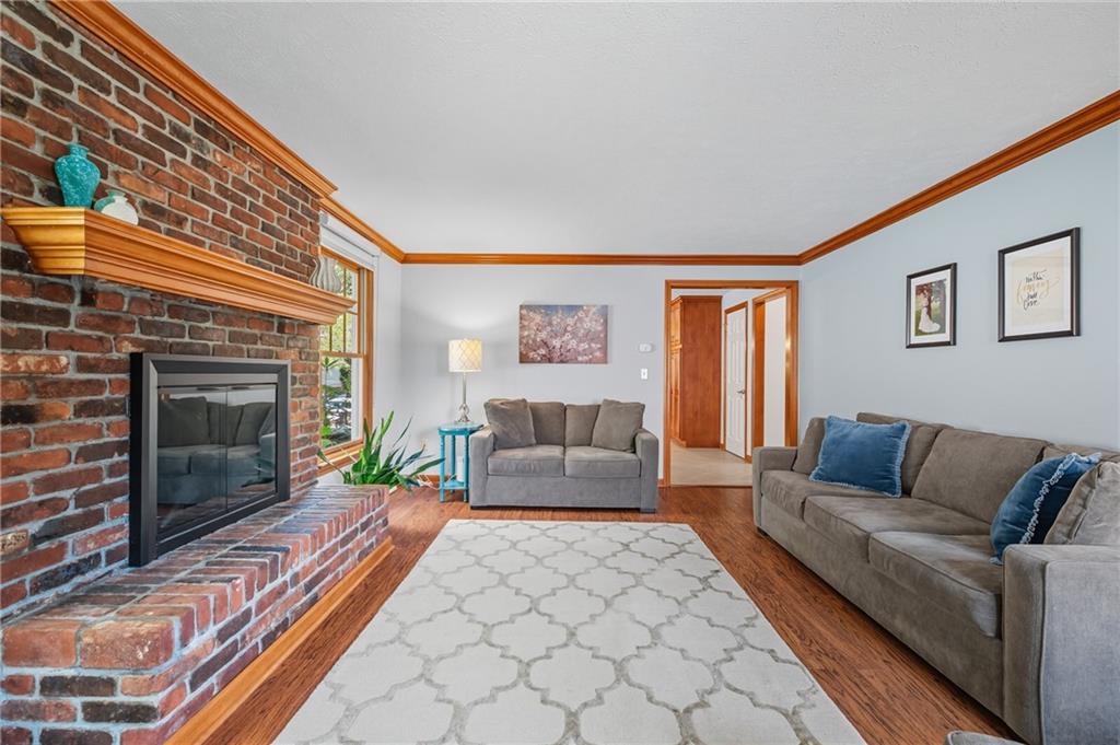 122 Rippling Brook Drive Sewickley, PA 15143 - Photo 4 of 31 a living room with furniture and a fireplace