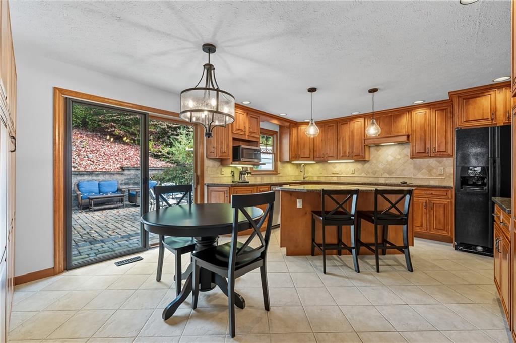 122 Rippling Brook Drive Sewickley, PA 15143 - Photo 9 of 31 a view of a dining room with furniture window and outside view