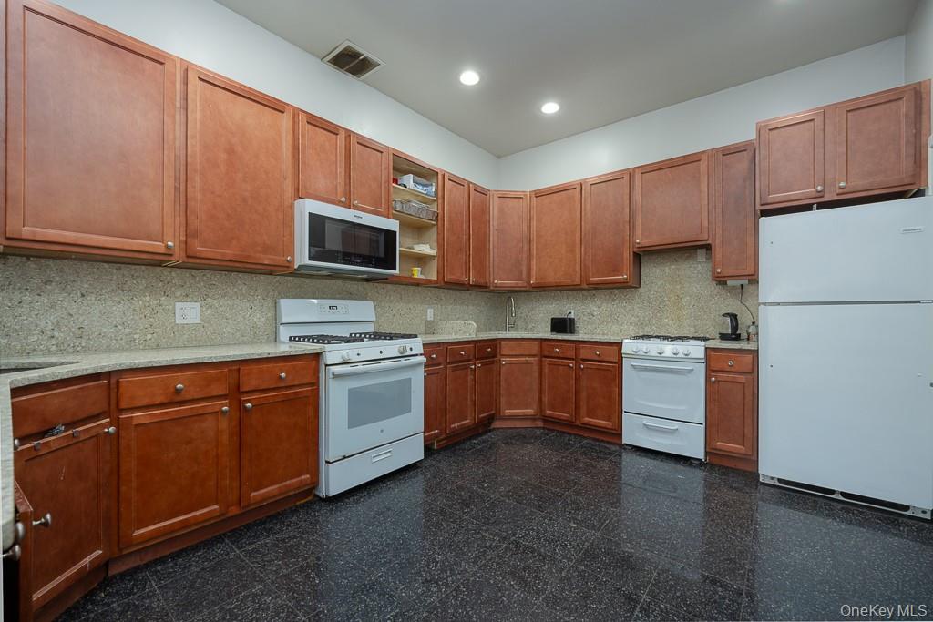 85 York Road Bloomingburg, NY 12721 - Photo 14 of 32 a kitchen with sink a microwave and cabinets