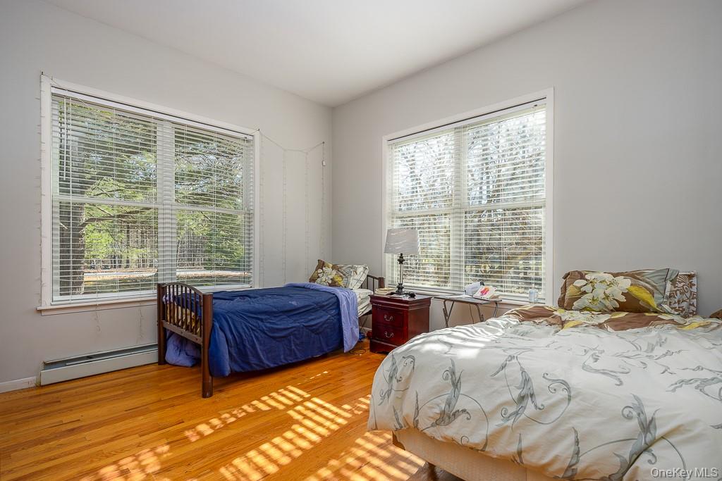 85 York Road Bloomingburg, NY 12721 - Photo 19 of 32 a bedroom with two beds and a large window
