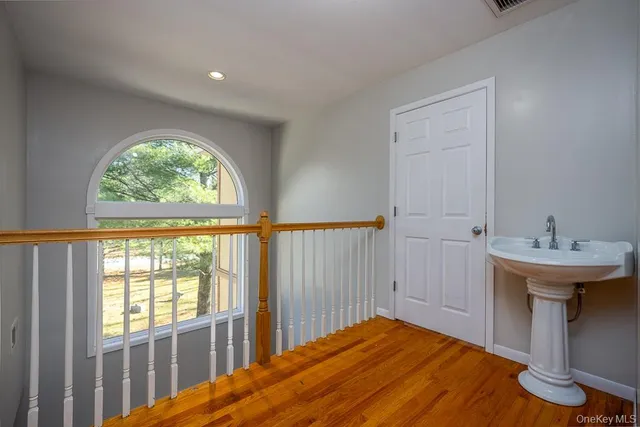 a bedroom with bed and a window