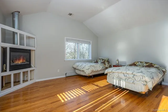 a spacious bathroom with a granite countertop tub sink a mirror a shower and vanity