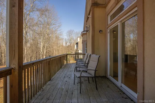 a view of a balcony with chairs