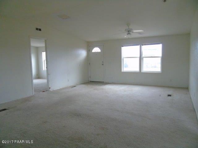 2480 East View Ridge Road Rimrock, AZ 86335 - Photo 5 of 20 an empty room with a empty space and windows
