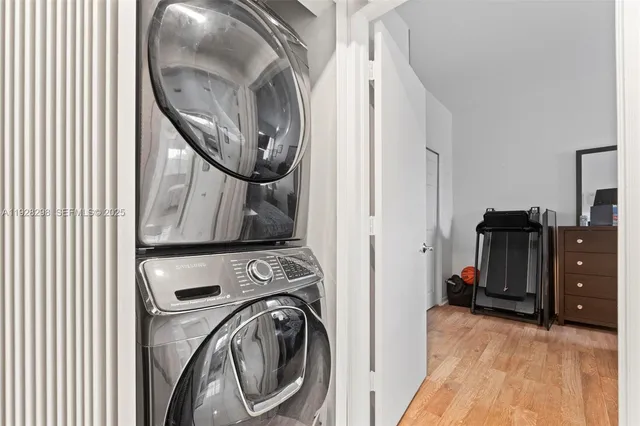 a view of a storage and utility room with washer and dryer