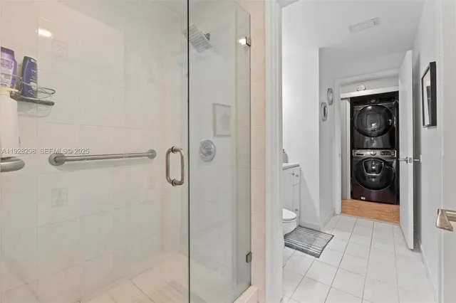 a bathroom with a shower and toilet