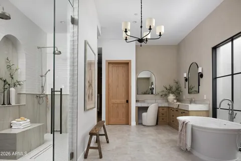a bathroom with a double vanity sink a toilet and a shower