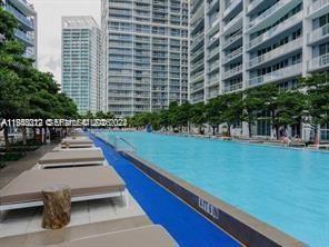 475 Brickell Avenue, Unit 2212 Miami, FL 33131 - Photo 10 of 19 a view of swimming pool with outdoor seating and plants