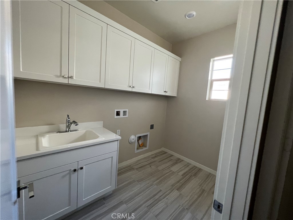 110 Sculpture Irvine, CA 92618 - Photo 12 of 37 a kitchen with sink and cabinets