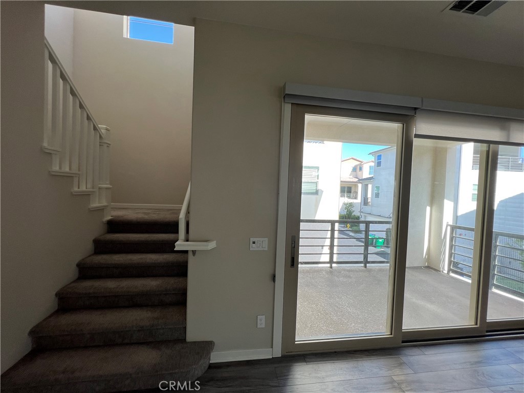 110 Sculpture Irvine, CA 92618 - Photo 28 of 37 a view of entryway with wooden floor and windows