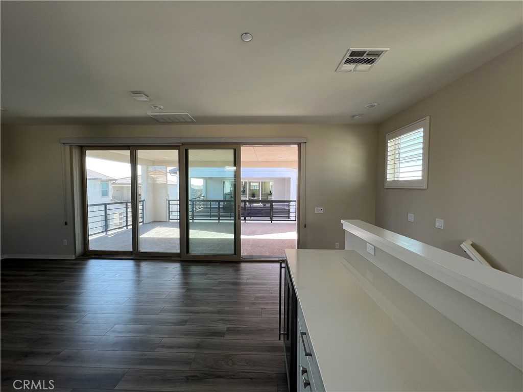 110 Sculpture Irvine, CA 92618 - Photo 30 of 37 a view of an empty room with wooden floor and a window