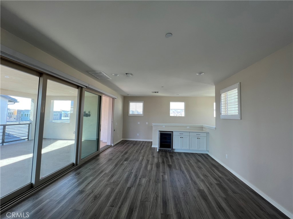 110 Sculpture Irvine, CA 92618 - Photo 32 of 37 a view of empty room with wooden floor and fireplace