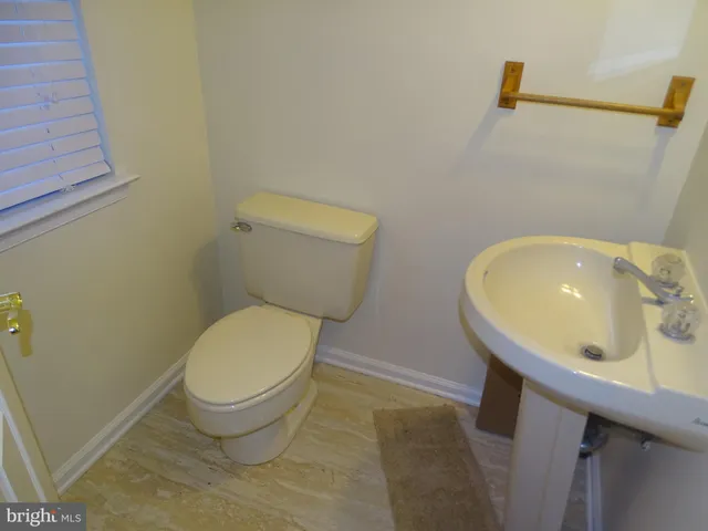 a bathroom with a toilet and a sink