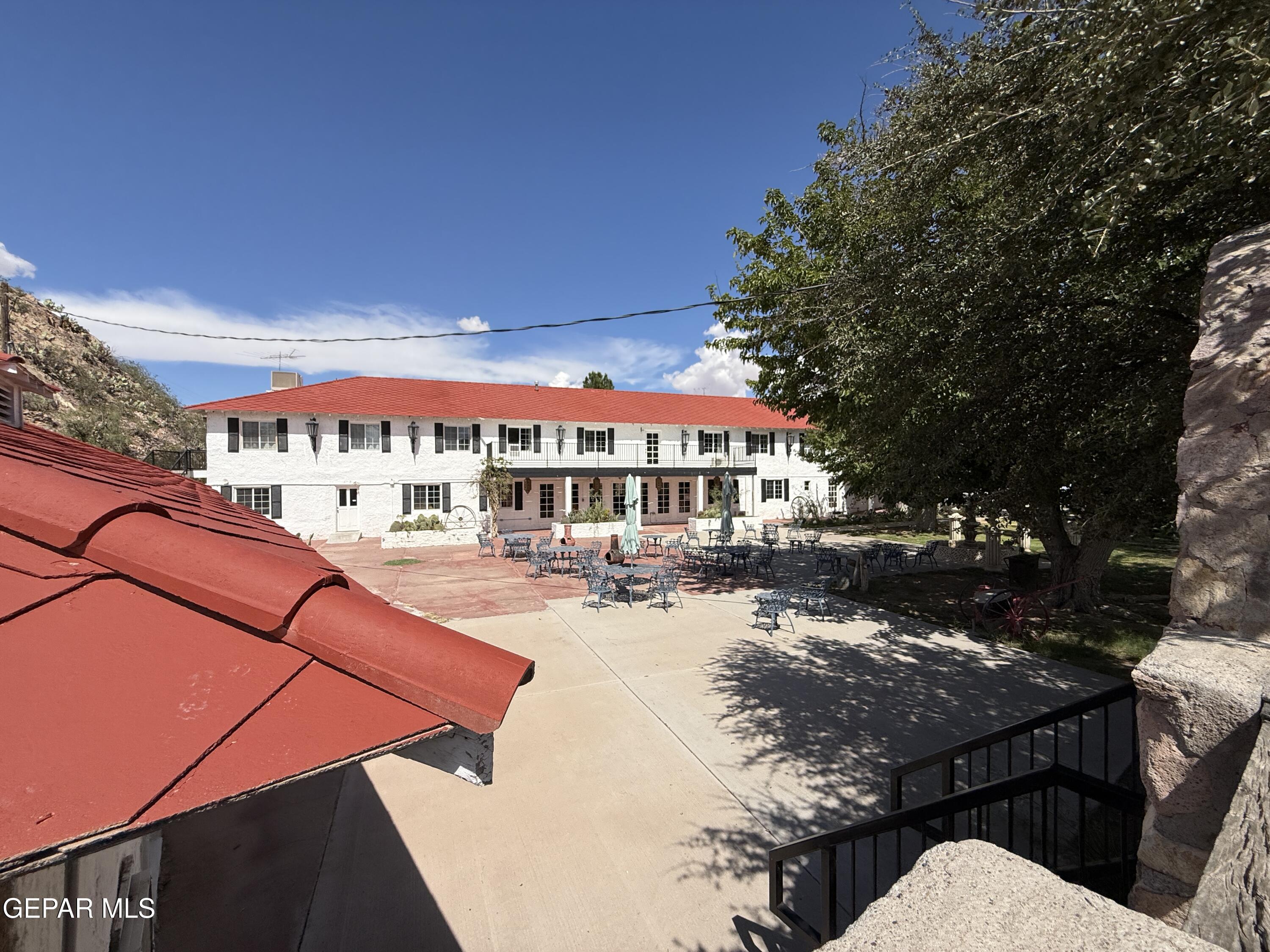 a view of swimming pool with outdoor seating