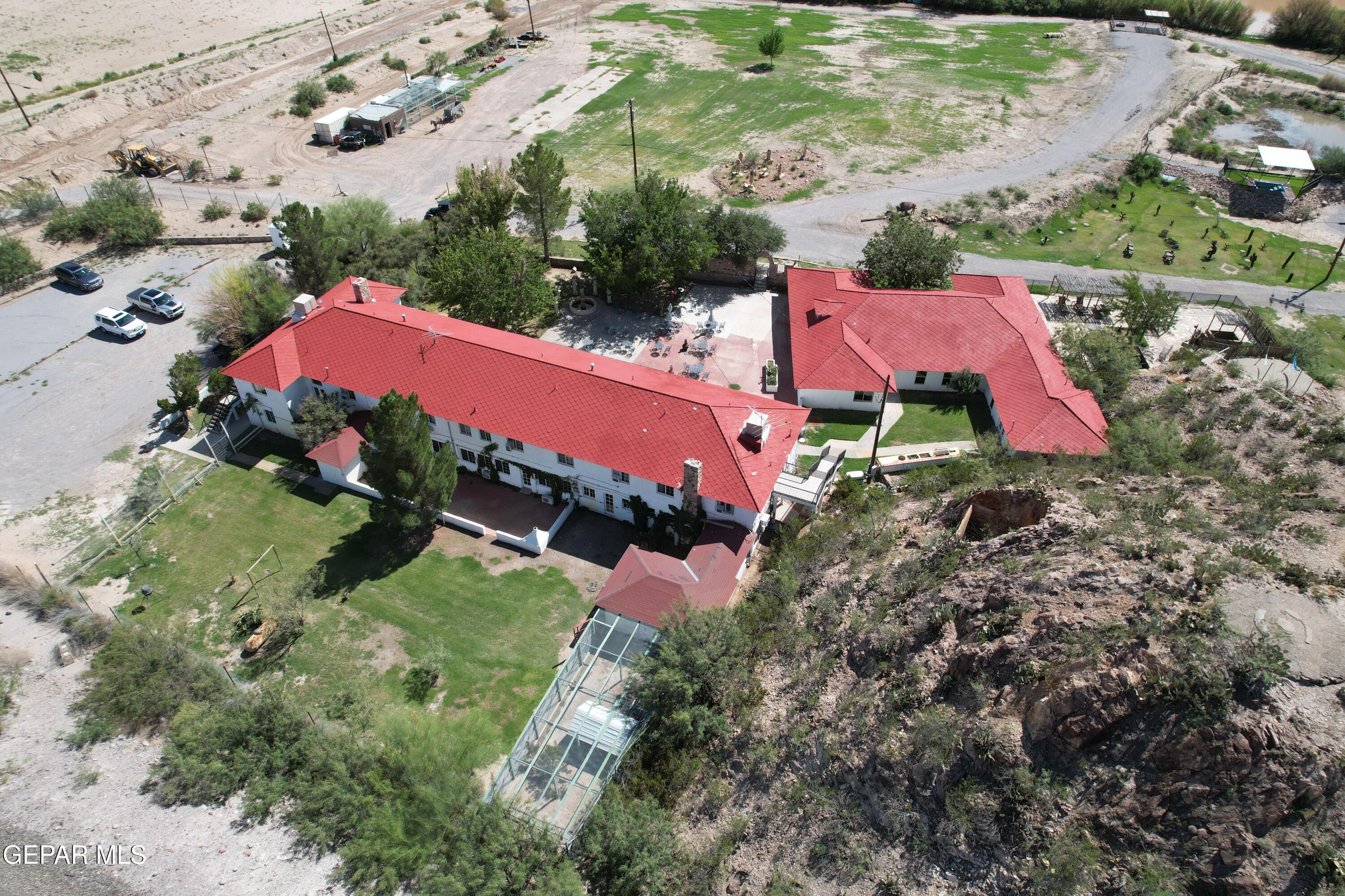 2200 County Rd D061 Las Cruces, NM 88007 - Photo 5 of 38 an aerial view of a house with a garden