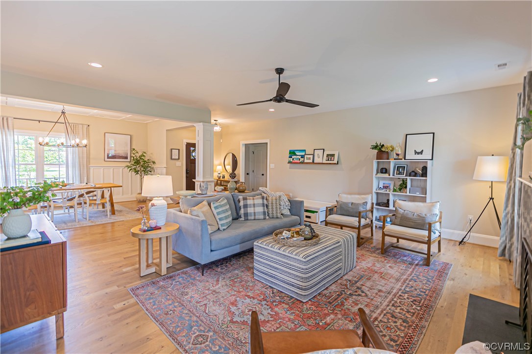 10337 Georgetown Road Mechanicsville, VA 23116 - Photo 17 of 50 Hardwood floored living room with ceiling fan with chandelier