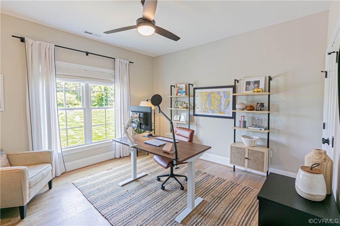 10337 Georgetown Road Mechanicsville, VA 23116 - Photo 32 of 50 Bedroom/Office space featuring a ceiling fan and natural light. Two Open bookcases do not convey.