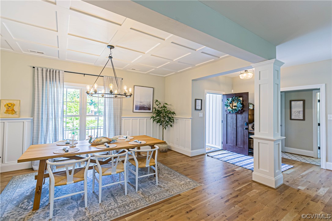 10337 Georgetown Road Mechanicsville, VA 23116 - Photo 10 of 50 Dining room featuring hardwood flooring and natural light. This room has coffered ceilings and Board & Batten panelling.