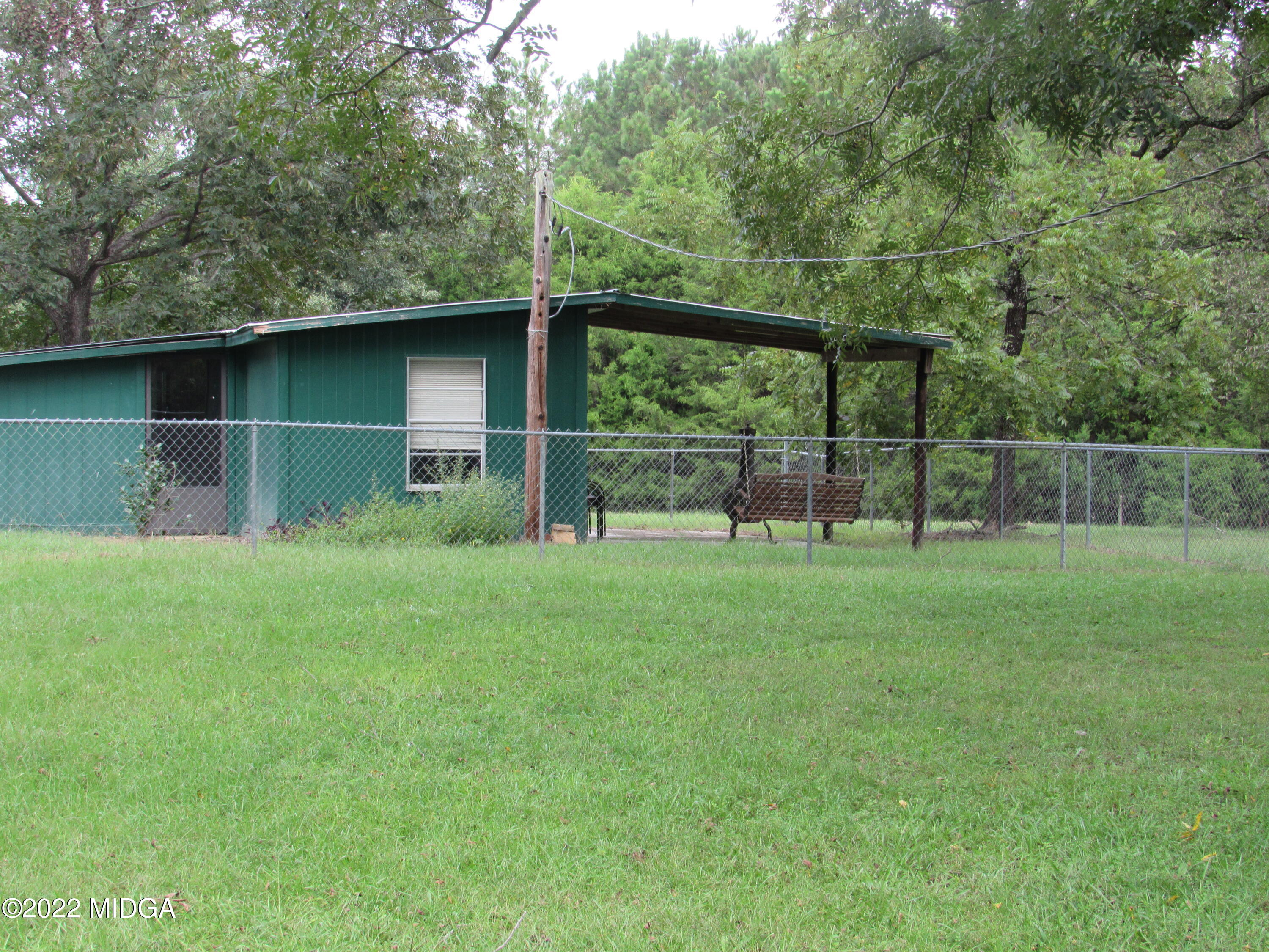 6999 South Rogers Road Macon, GA 31216 - Photo 12 of 61 a backyard of a house with lots of green space