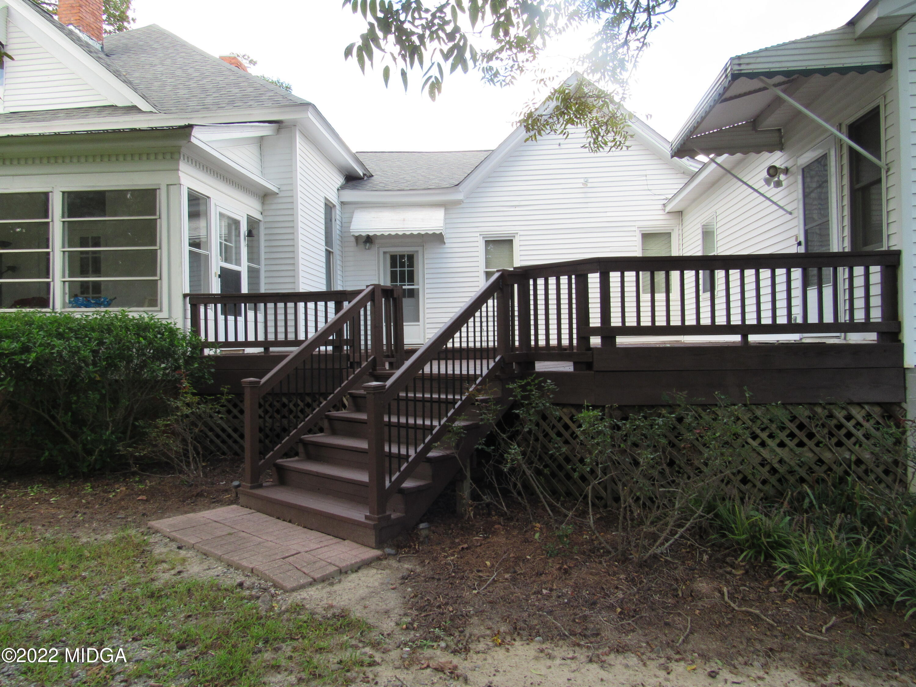 6999 South Rogers Road Macon, GA 31216 - Photo 20 of 61 a view of a house with a deck