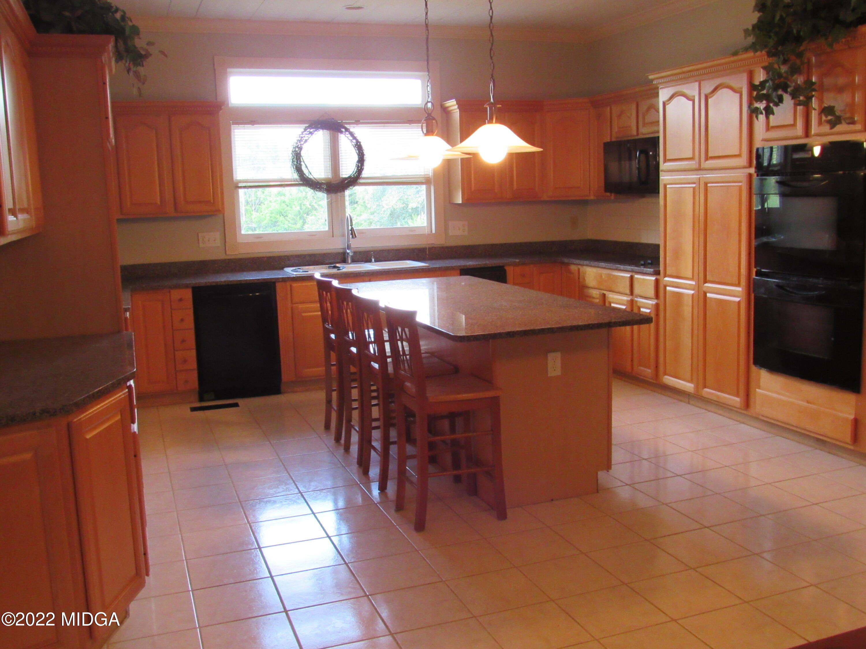 6999 South Rogers Road Macon, GA 31216 - Photo 31 of 61 view of kitchen with refrigerator and window