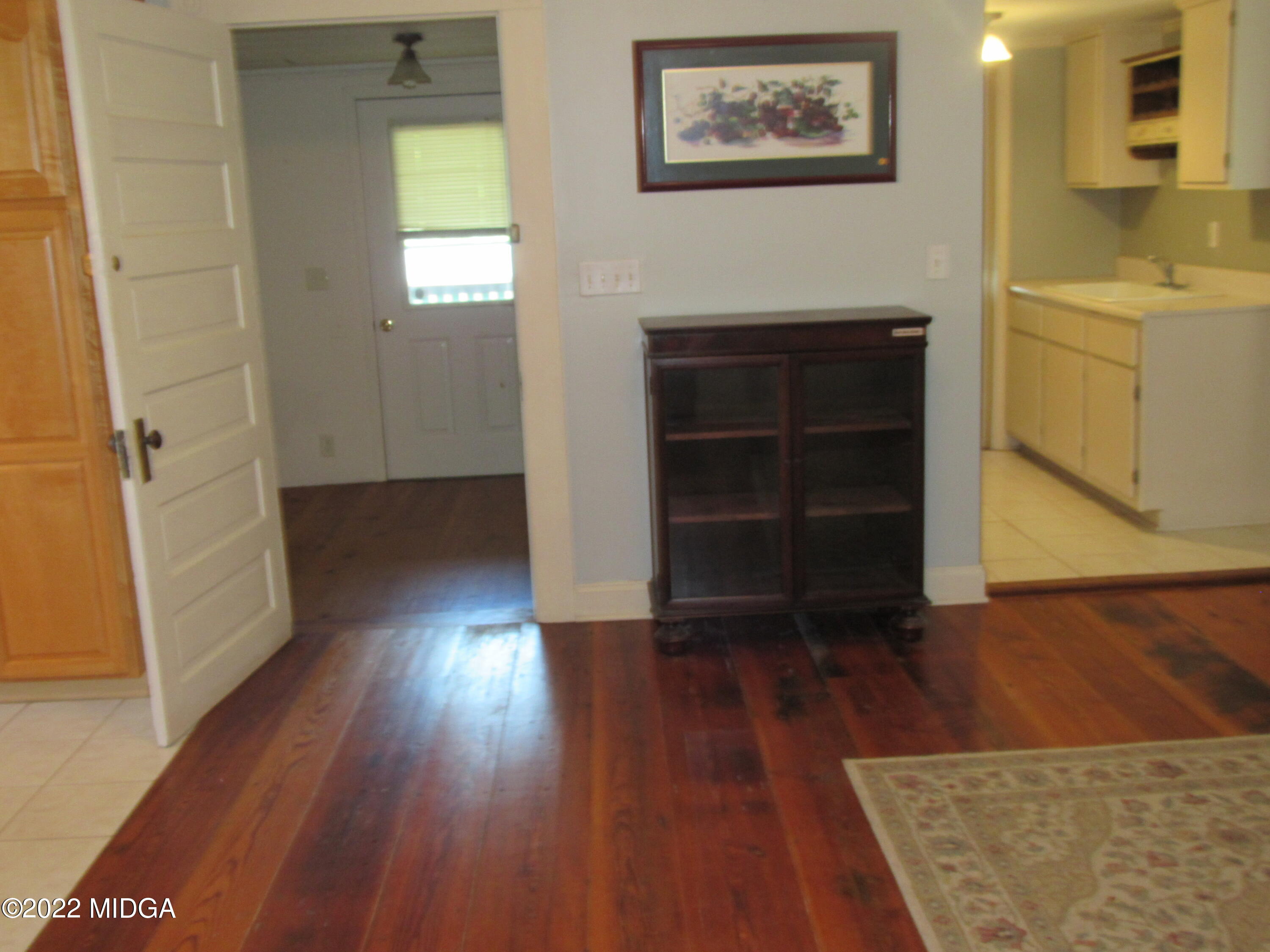 6999 South Rogers Road Macon, GA 31216 - Photo 35 of 61 wooden floor in an empty room and a window
