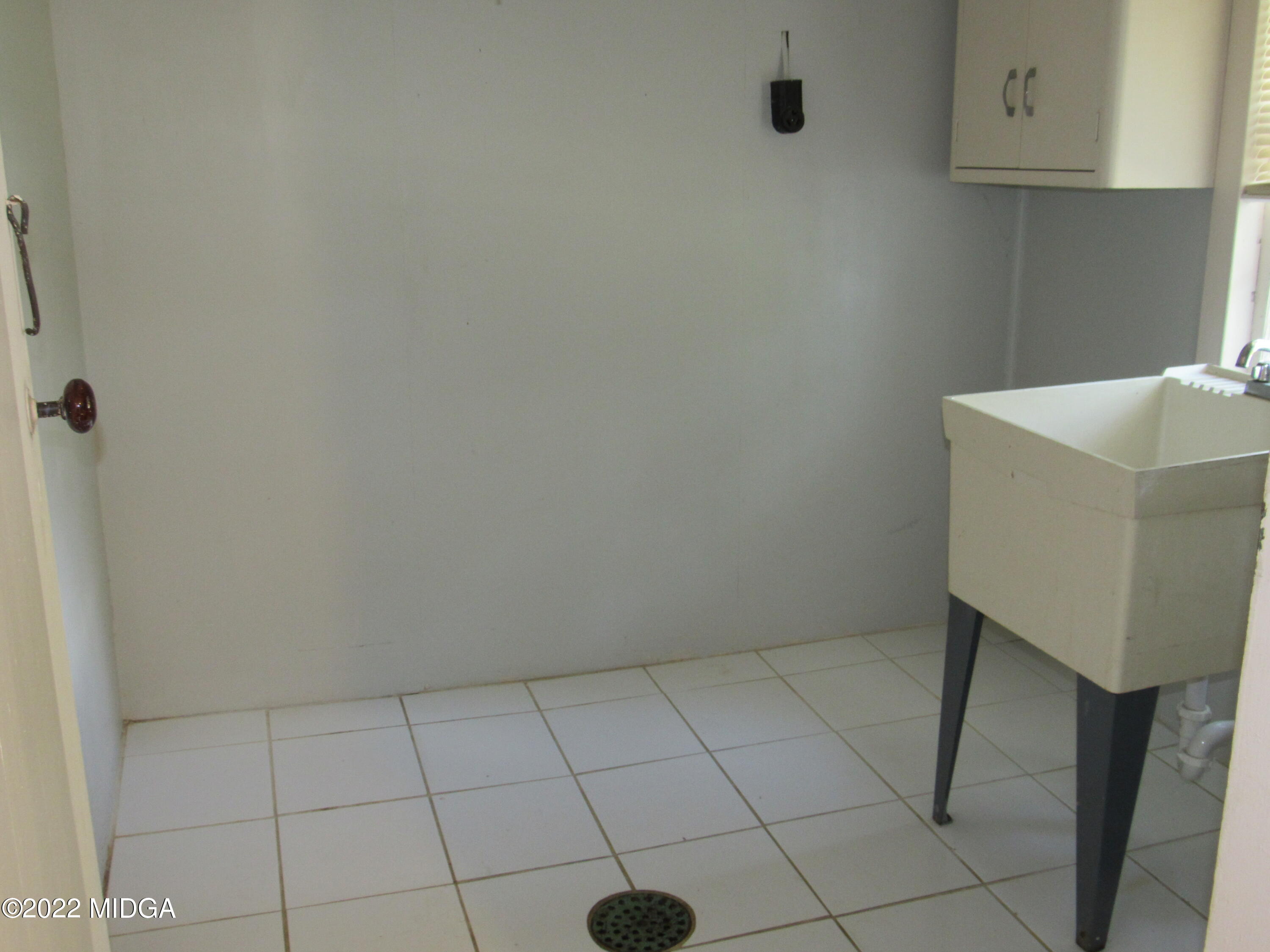 6999 South Rogers Road Macon, GA 31216 - Photo 36 of 61 a view of small space with racks on the wall