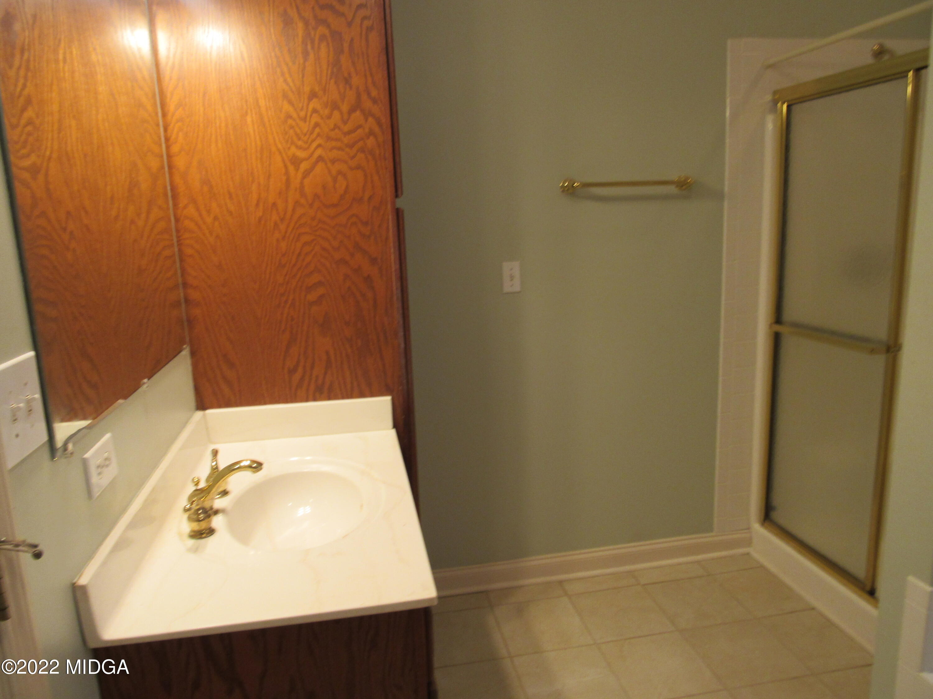 6999 South Rogers Road Macon, GA 31216 - Photo 42 of 61 a bathroom with a sink and a vanity