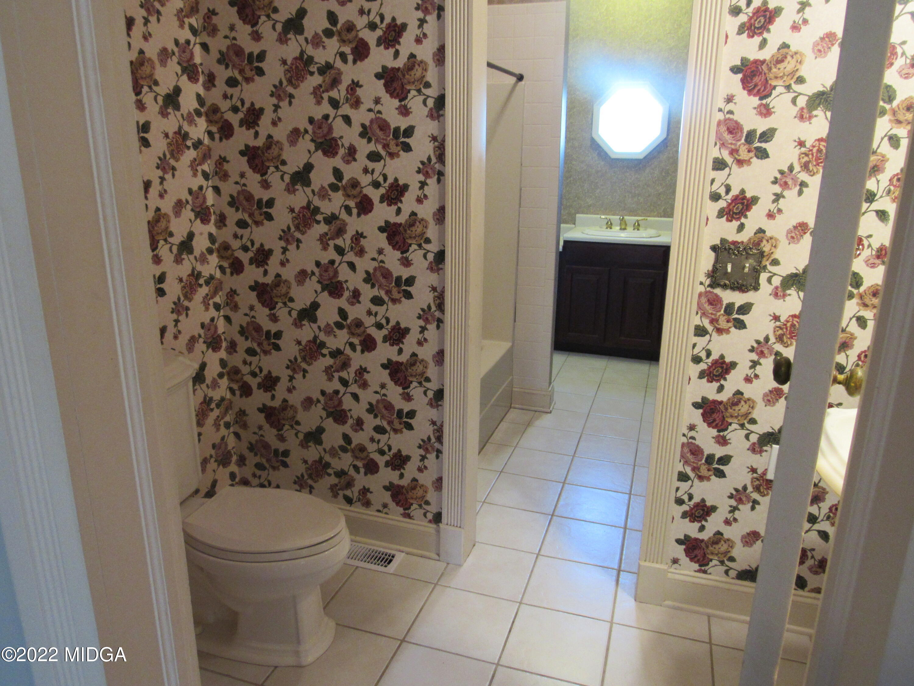 6999 South Rogers Road Macon, GA 31216 - Photo 49 of 61 a bathroom with a toilet and a shower