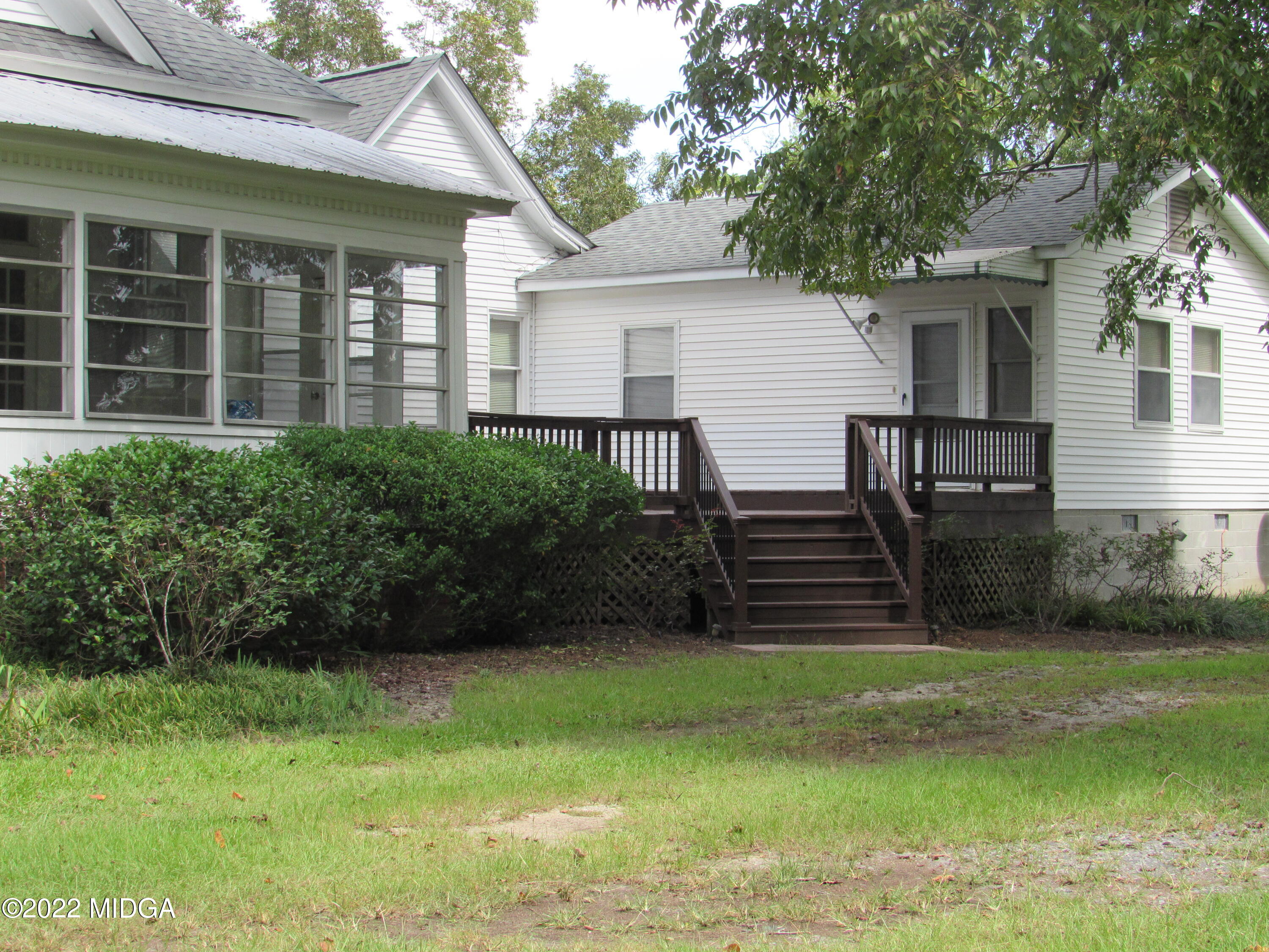 6999 South Rogers Road Macon, GA 31216 - Photo 7 of 61 a front view of a house with garden