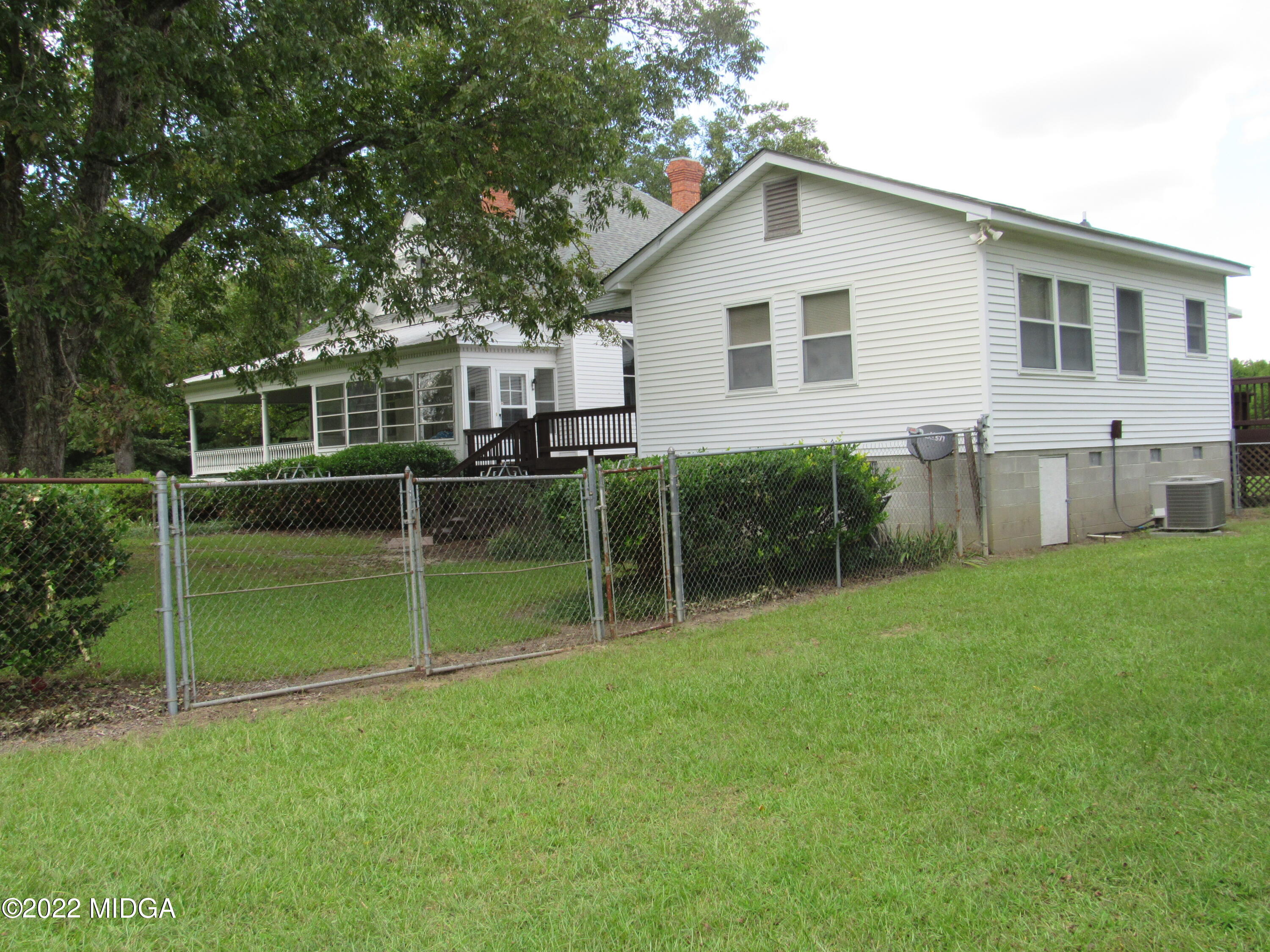 6999 South Rogers Road Macon, GA 31216 - Photo 10 of 61 a view of house with backyard