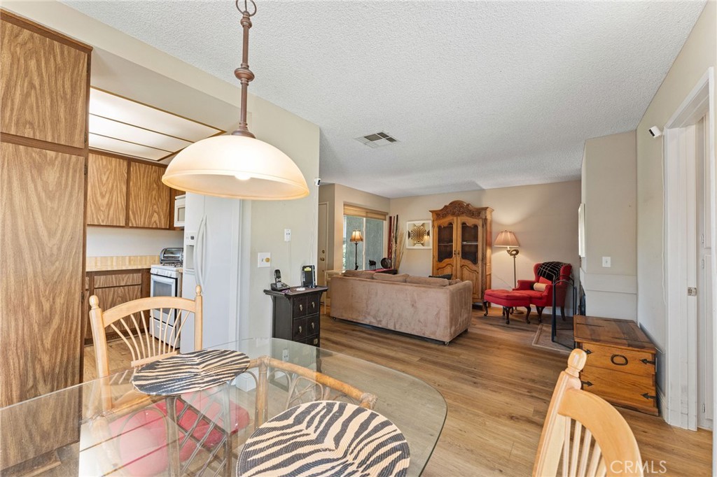 92 Orchard Irvine, CA 92618 - Photo 13 of 46 a living room with furniture and a chandelier