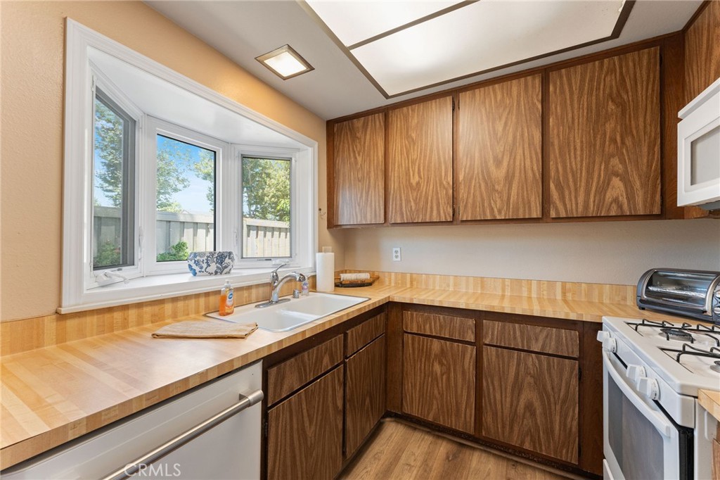 92 Orchard Irvine, CA 92618 - Photo 15 of 46 a kitchen with a sink and a window