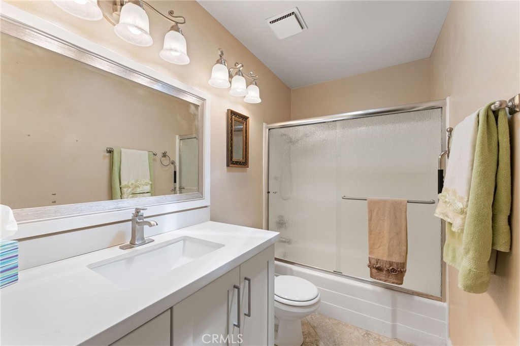 92 Orchard Irvine, CA 92618 - Photo 18 of 46 a bathroom with a sink a toilet and shower