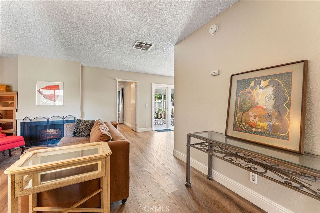 92 Orchard Irvine, CA 92618 - Photo 3 of 46 a living room with furniture and a painting on the wall