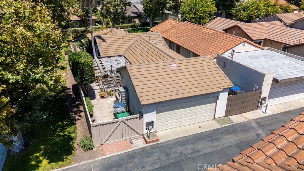 92 Orchard Irvine, CA 92618 - Photo 35 of 46 a view of a patio with table and chairs with wooden floor and fence