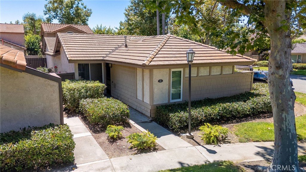 92 Orchard Irvine, CA 92618 - Photo 44 of 46 a view of a house with a yard and plants