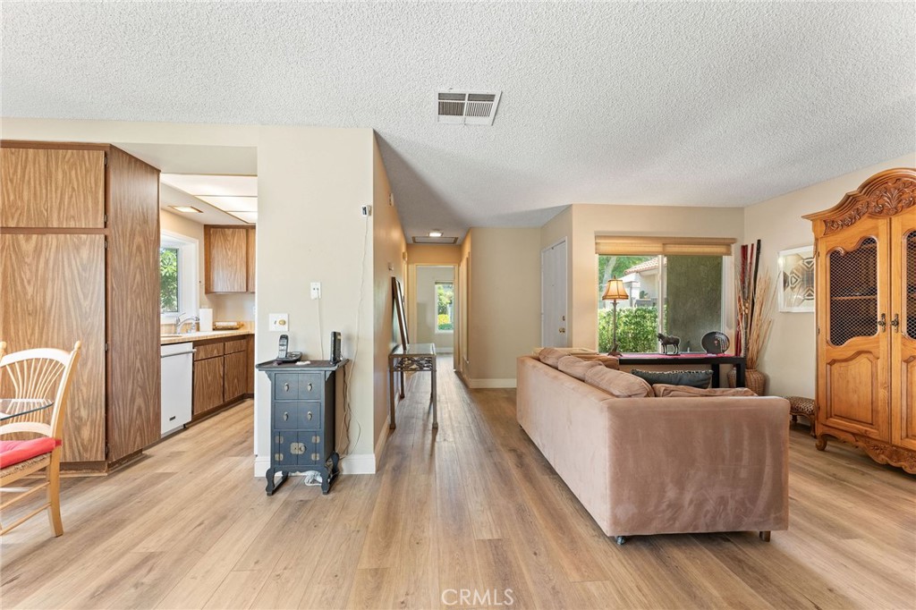 92 Orchard Irvine, CA 92618 - Photo 6 of 46 a living room with furniture and a large window