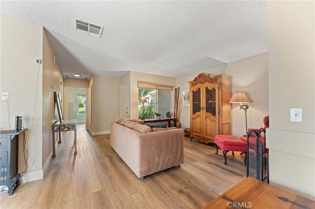 92 Orchard Irvine, CA 92618 - Photo 7 of 46 a living room with furniture and a wooden floor