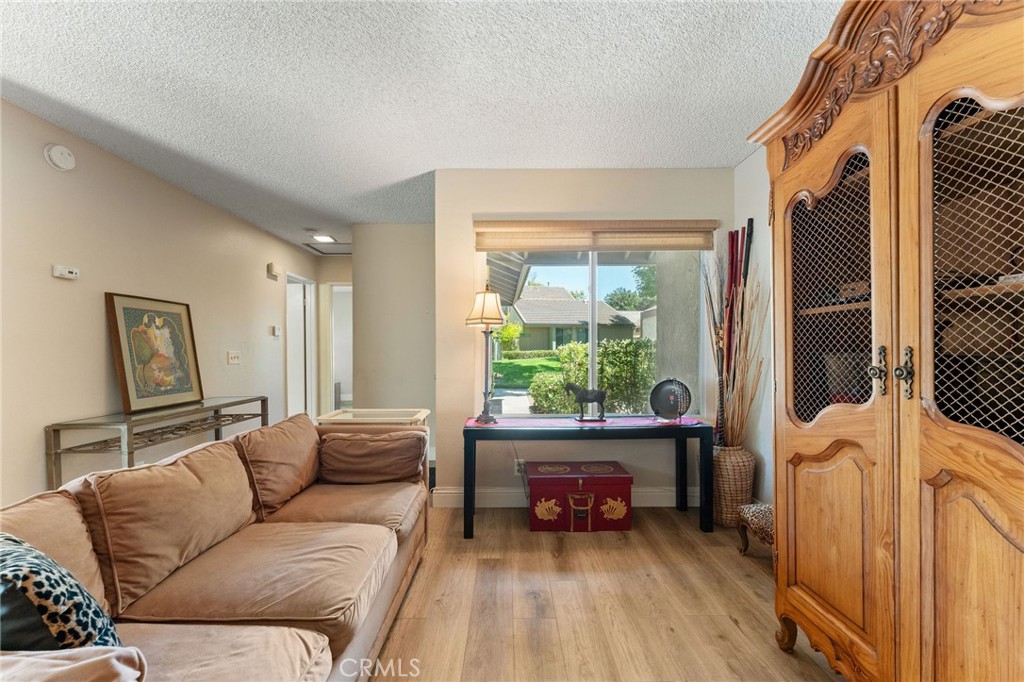 92 Orchard Irvine, CA 92618 - Photo 8 of 46 a living room with furniture and a large window