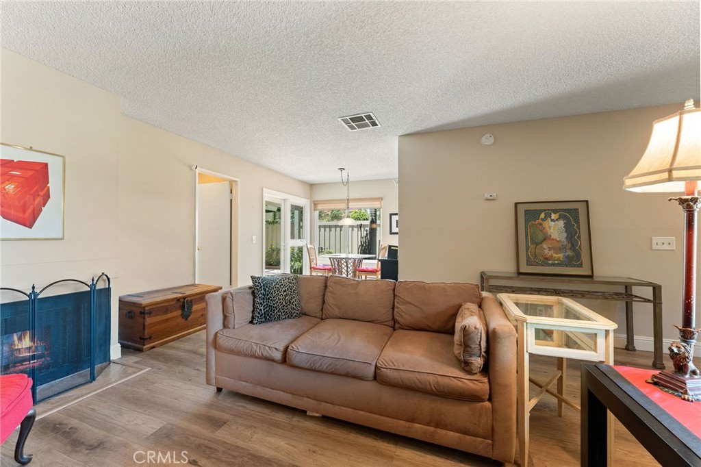 92 Orchard Irvine, CA 92618 - Photo 9 of 46 a living room with furniture and a flat screen tv