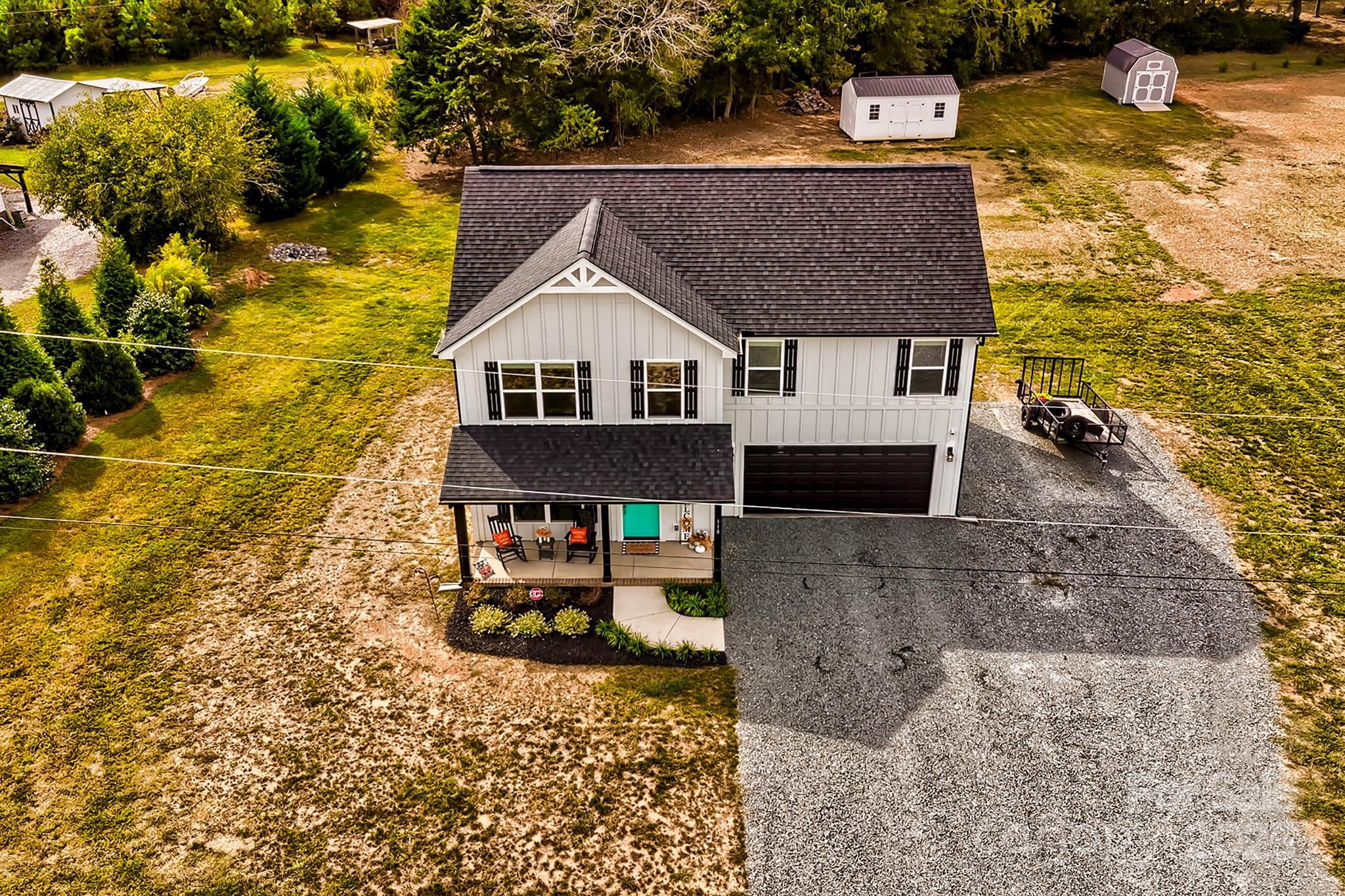 118 Griffin Road Pageland, SC 29728 - Photo 8 of 32 a aerial view of a house with a swimming pool