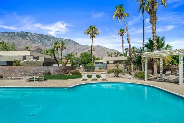 a view of a swimming pool with a patio
