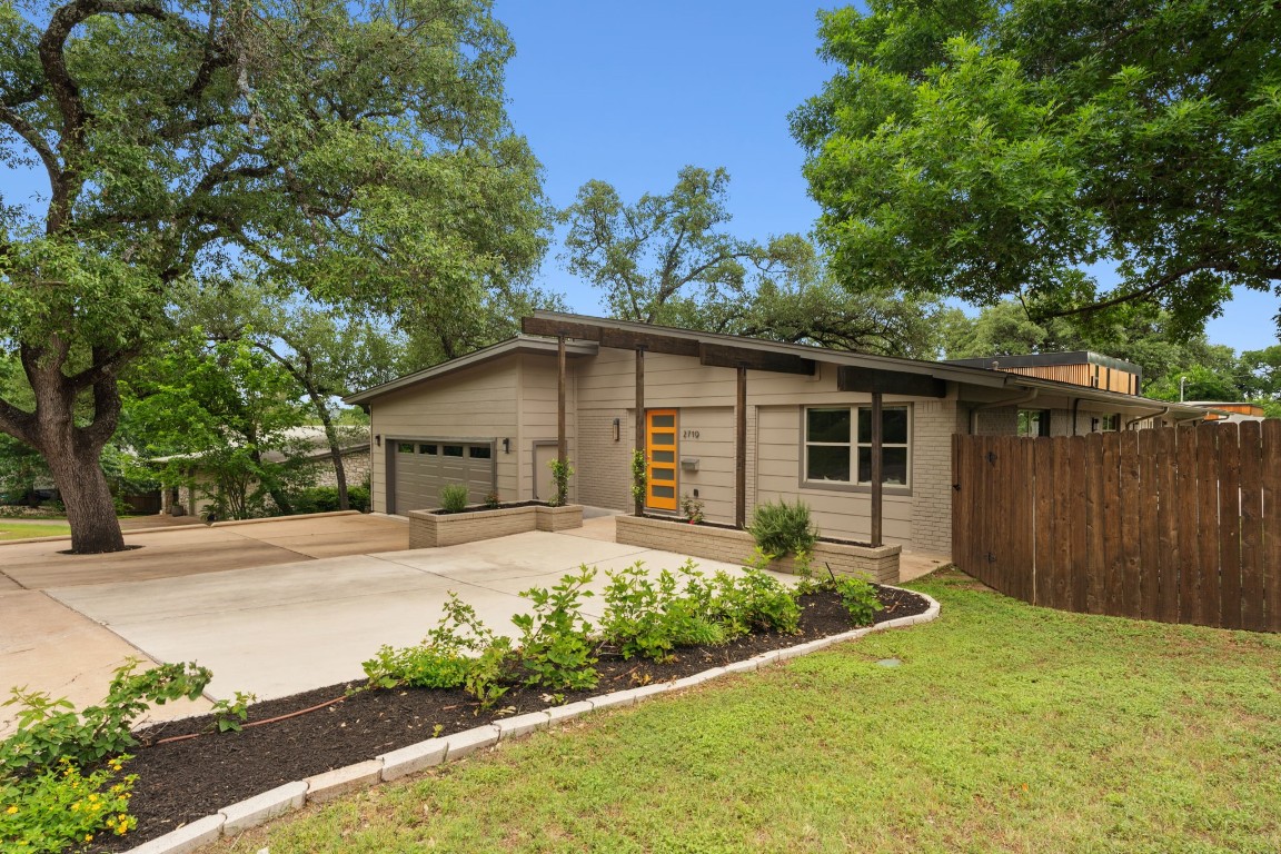 Welcome to 2719 Barton Skyway, a beautiful and unique, large mid-century modern home in desirable Barton Hills!