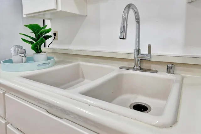 a bathroom with a sink a vanity and a mirror
