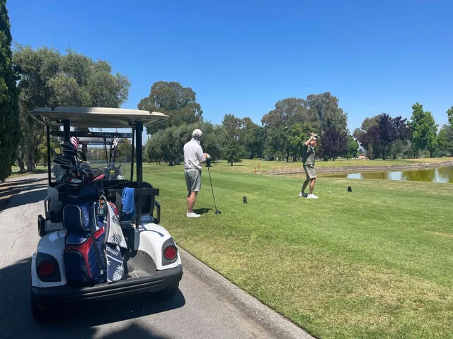 a front view of a house with a garden and plants