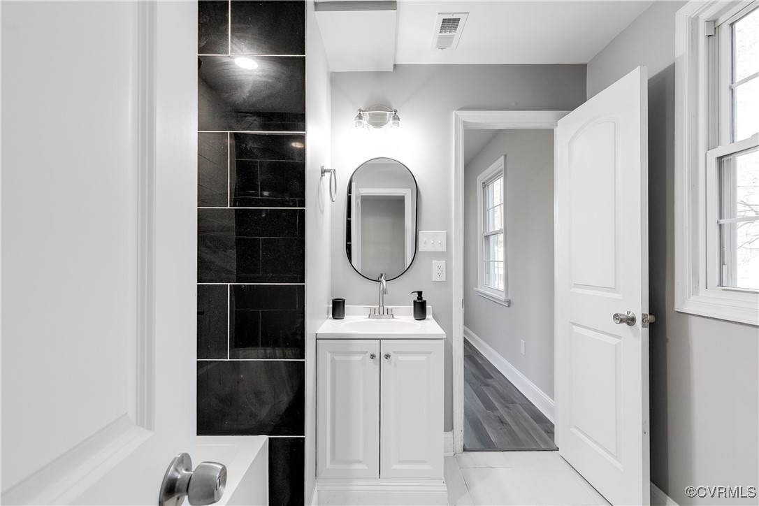 4308 Penick Road Henrico, VA 23228 - Photo 24 of 48 Bathroom with hardwood / wood-style floors, vanity