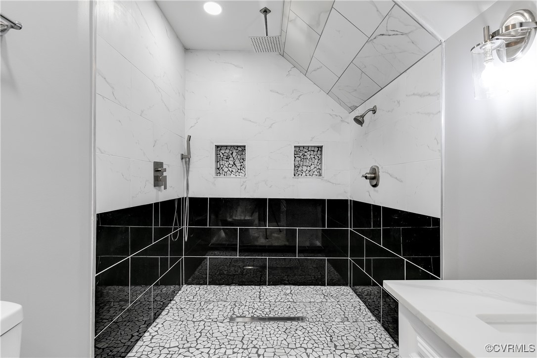4308 Penick Road Henrico, VA 23228 - Photo 39 of 48 Bathroom with tiled shower, toilet, and tile walls