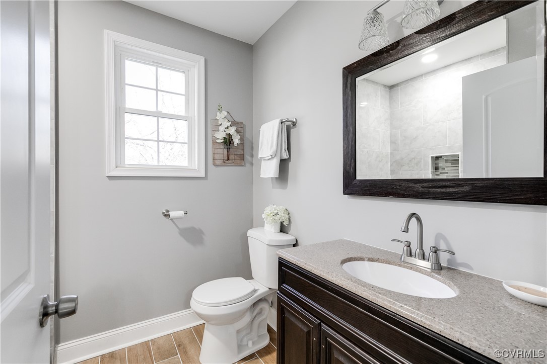 4308 Penick Road Henrico, VA 23228 - Photo 40 of 48 Bathroom with vanity, wood-type flooring, and toil